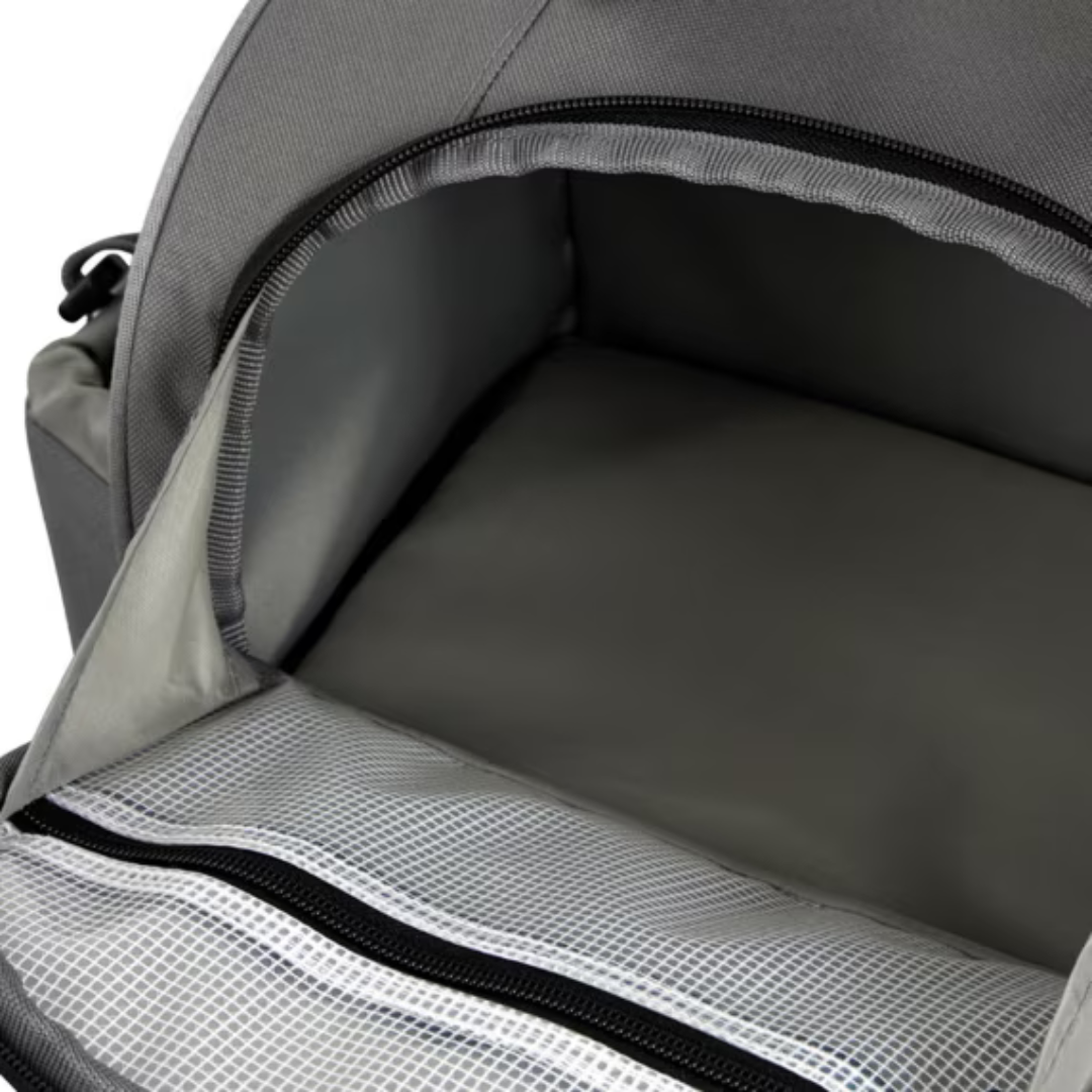 Interior view of Shimano medium backpack's spacious main compartment with zippered mesh pocket for secure storage.