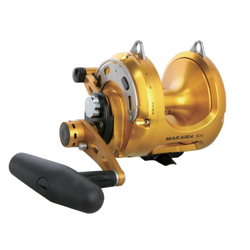 OKUMA Makaira Two Speed Lever Drag 50II fishing reel in gold finish, featuring a durable handle and precision drag system for big game fishing.